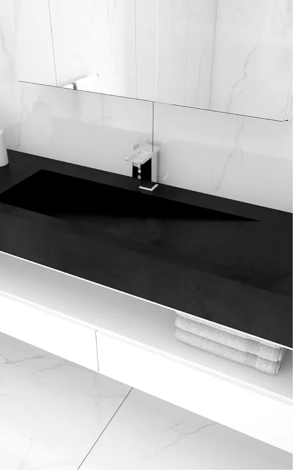 a black sink with white counter top